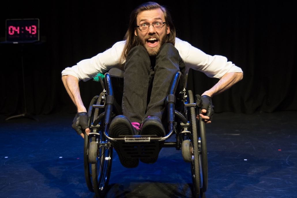 A man in a wheelchair on stage