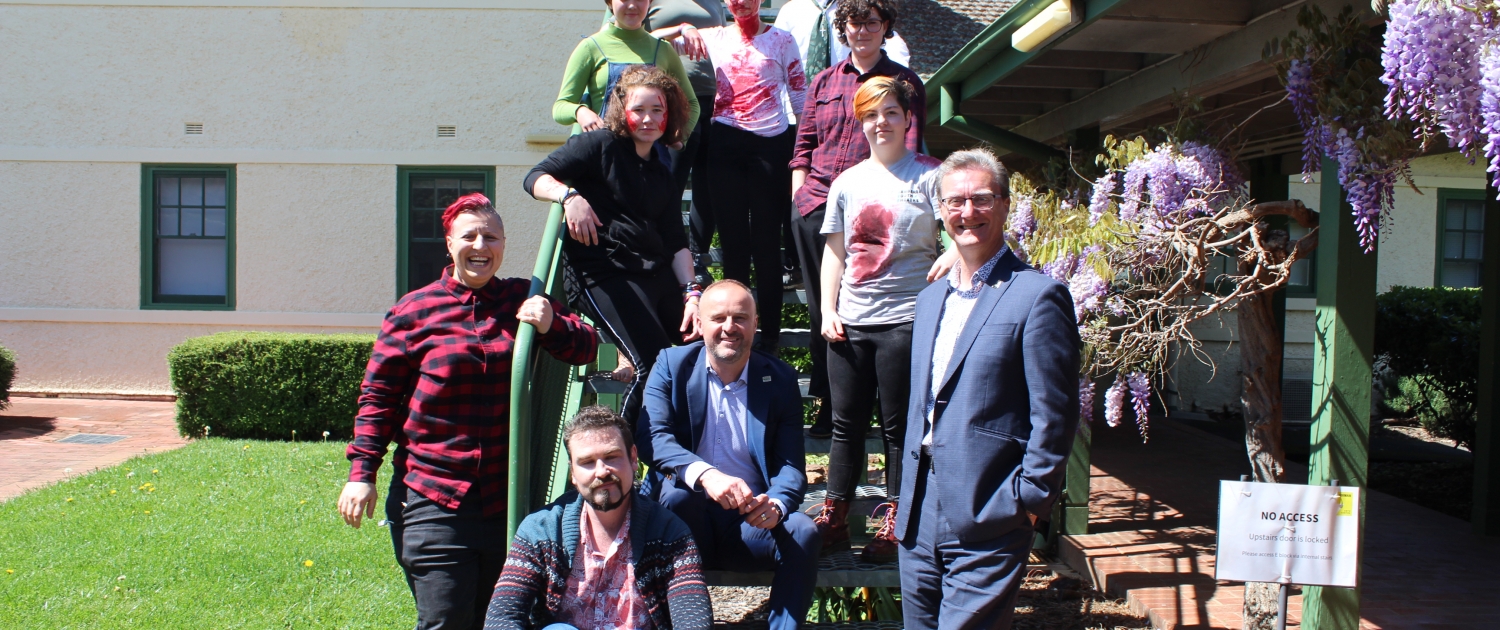 Acting Out participants and tutors smiling for the camera alongside ACT Chief Minister Andrew Barr