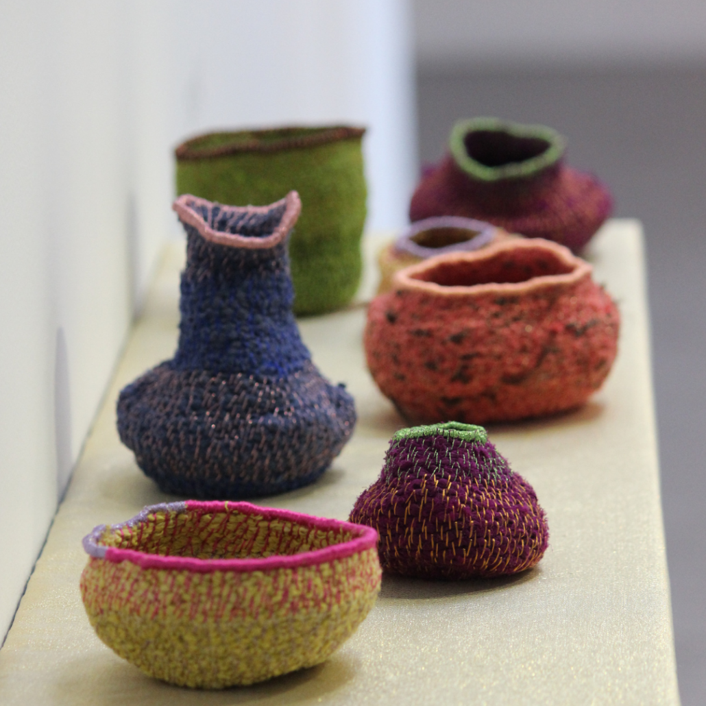 6 textile pots in various bring colours