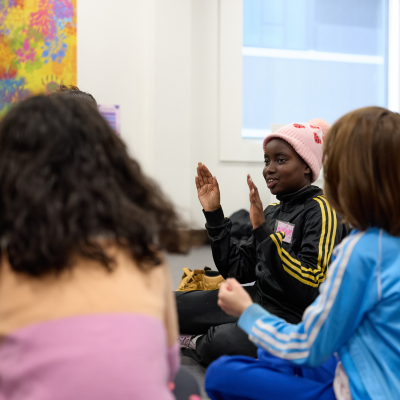 A group of children from different cultural backgrounds smile and play games