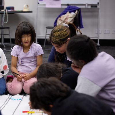 A group of children from different cultural backgrounds smile and play games
