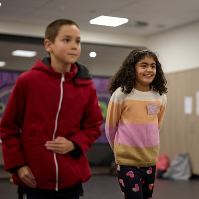 A group of children from different cultural backgrounds smile and play games